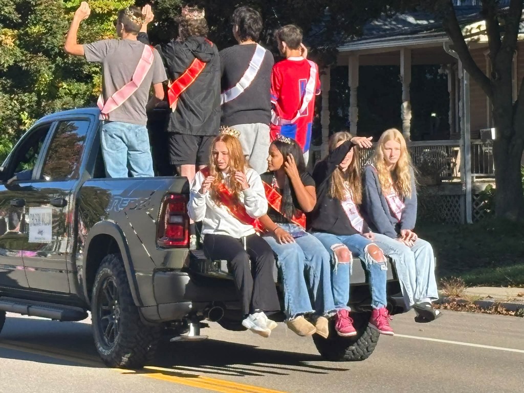 Truck with tailgate down and kids sitting on it