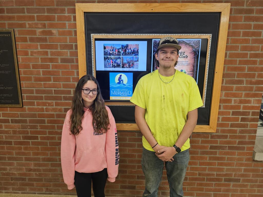 Two students posing for picture