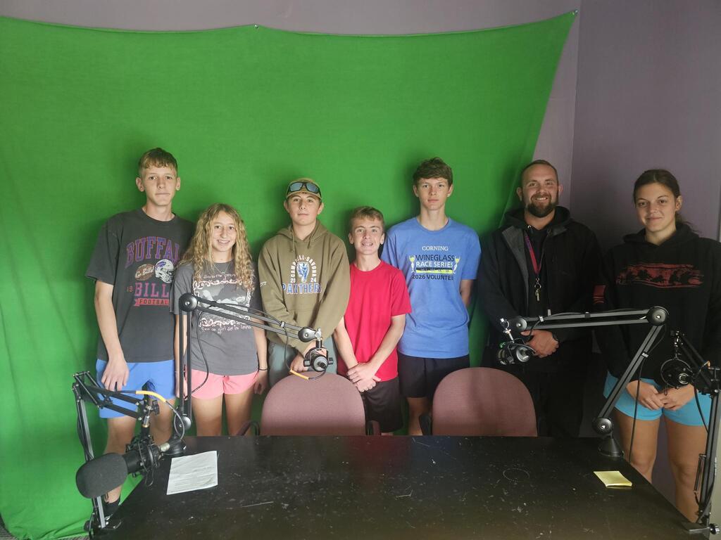 Cross country team in front of green screen