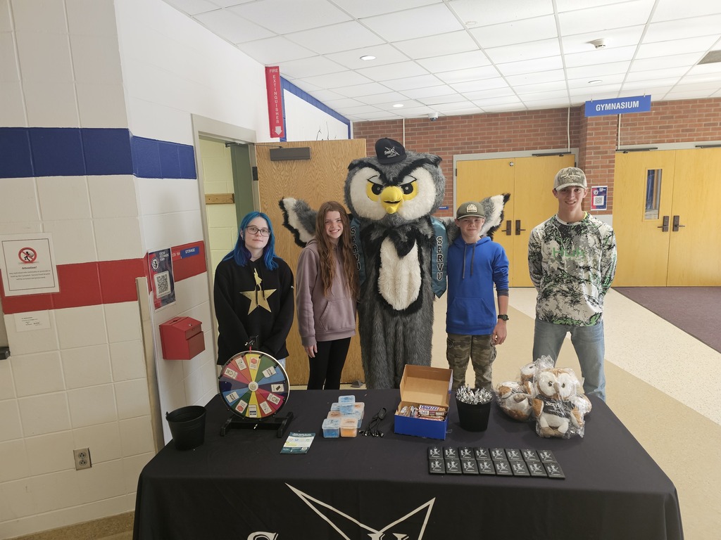 Grou picture of students with owl mascot