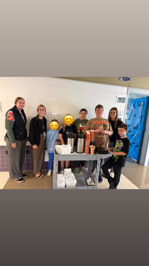 Group photo of studnets and teacher in coffee cart