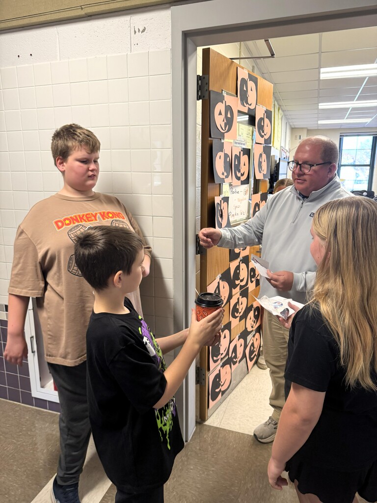 Kids giving coffee to adult