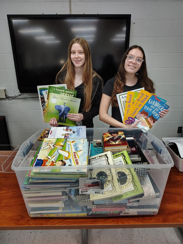 President Taylor Coleman and Vice President Rita-Joy Wheeler with donations