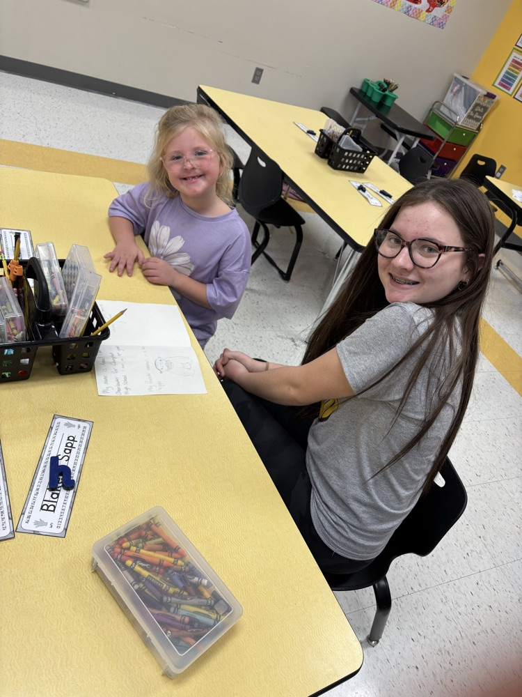 Anna Peters reading the card she made for her Kindergartner.