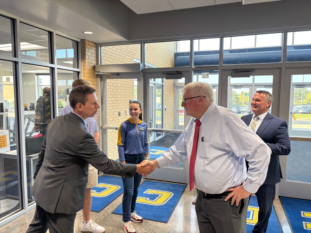 CHS Principal Mark Wittig shakes hands with Congressman Glenn Grothman.