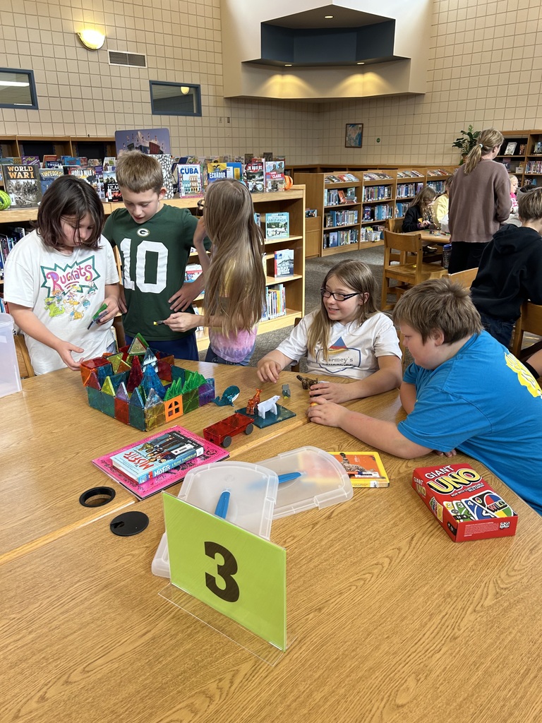 Students playing with magnetic tiles