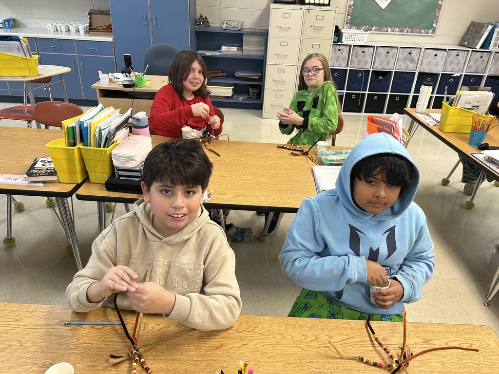 Students making bead corn