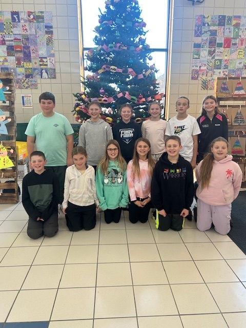 Student council pictured in front of the CES Christmas tree