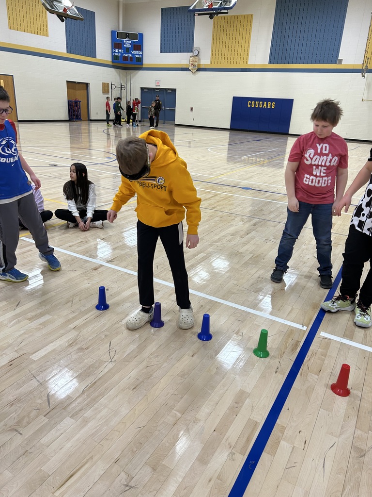 5th graders doing the drunk goggles obstacle course