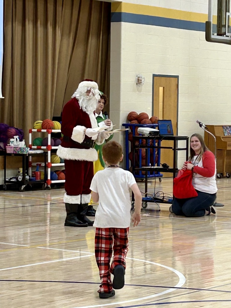 Santa and Buddy the elf handing out a cougar in action award