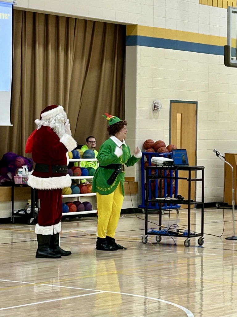 Santa and buddy the elf at the assembly