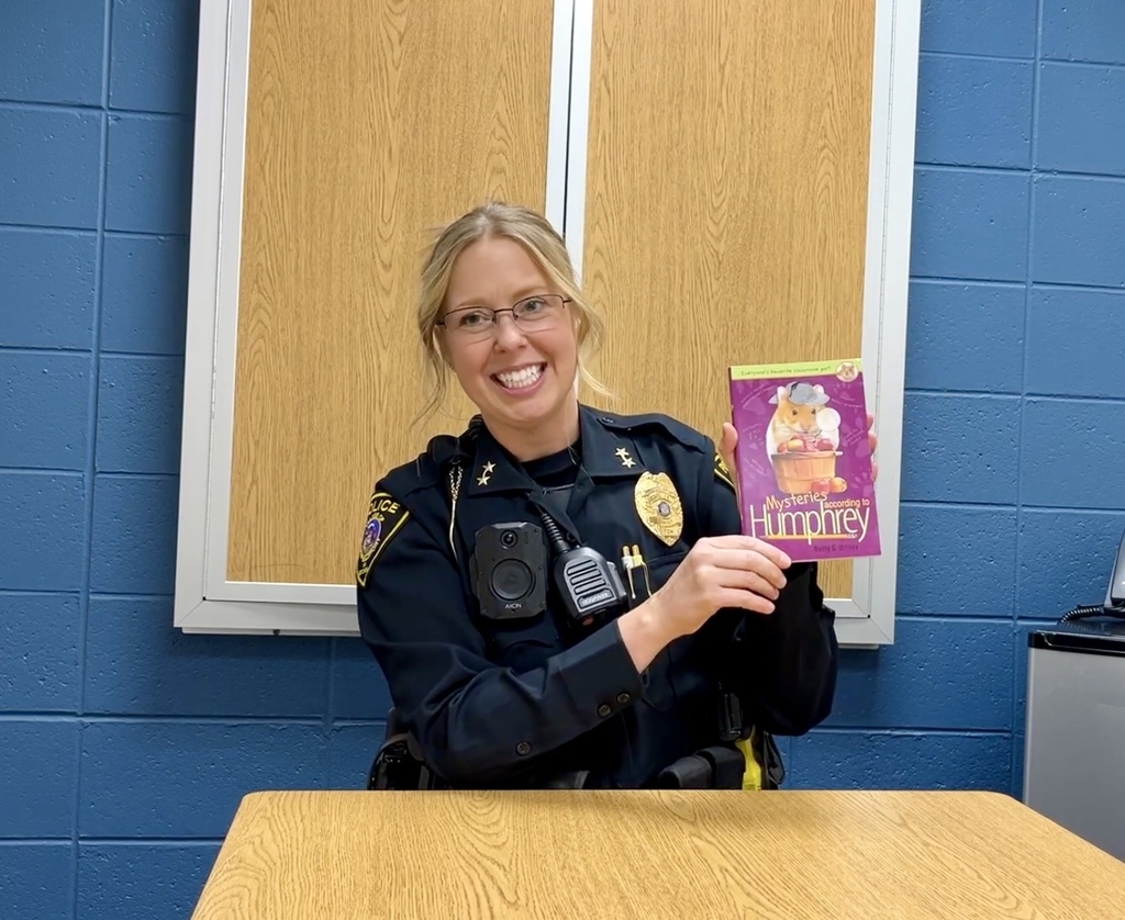 Police Chief Dowland showing off our school wide book