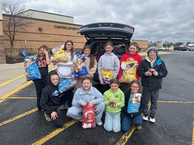Student council with pet supply drive donations 