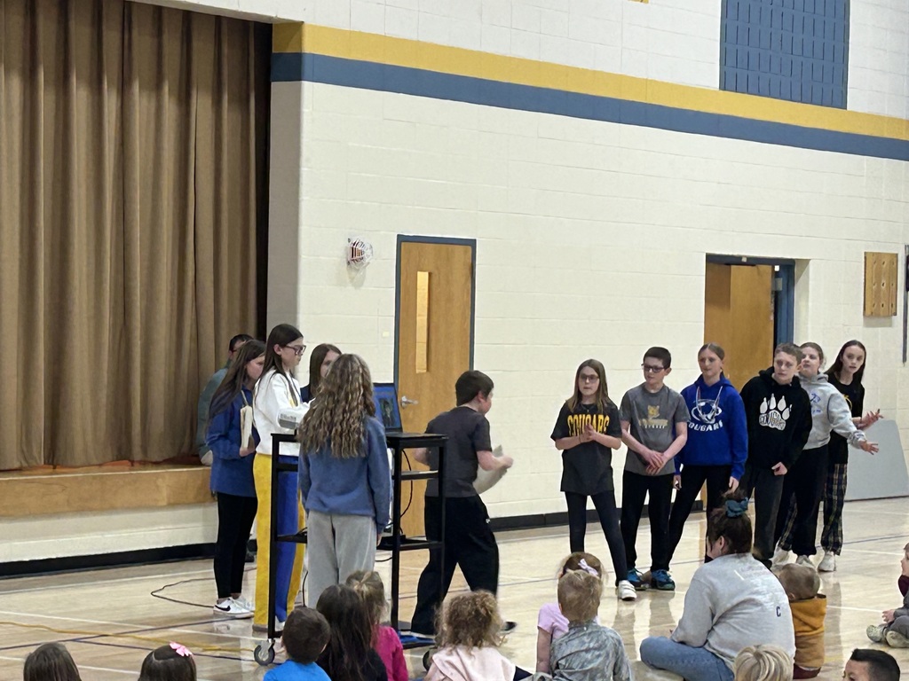 Student council handing out Cougar in action awards 