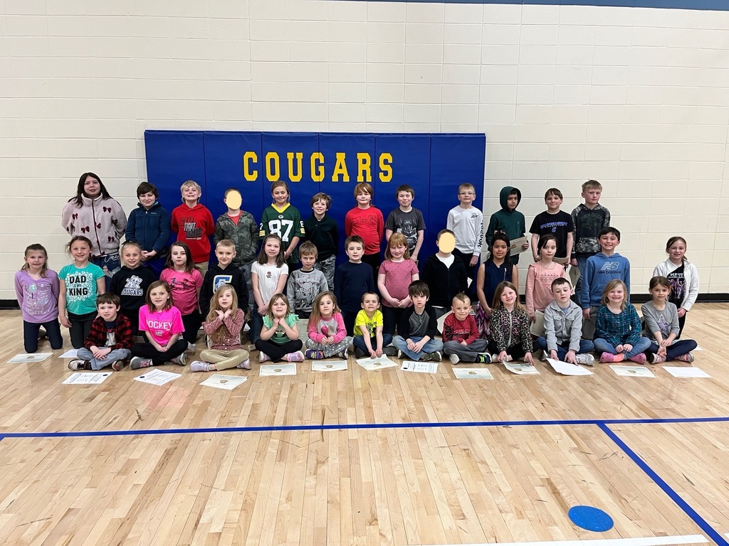 Students who won cougar in action awards pictured in a group 