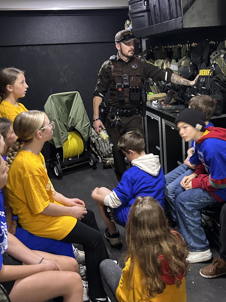 Deputy Behm talking to students about swat gear