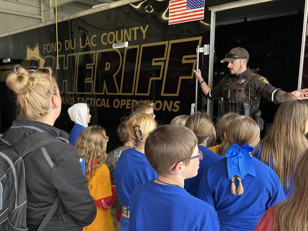 Students learning about the SWAT team