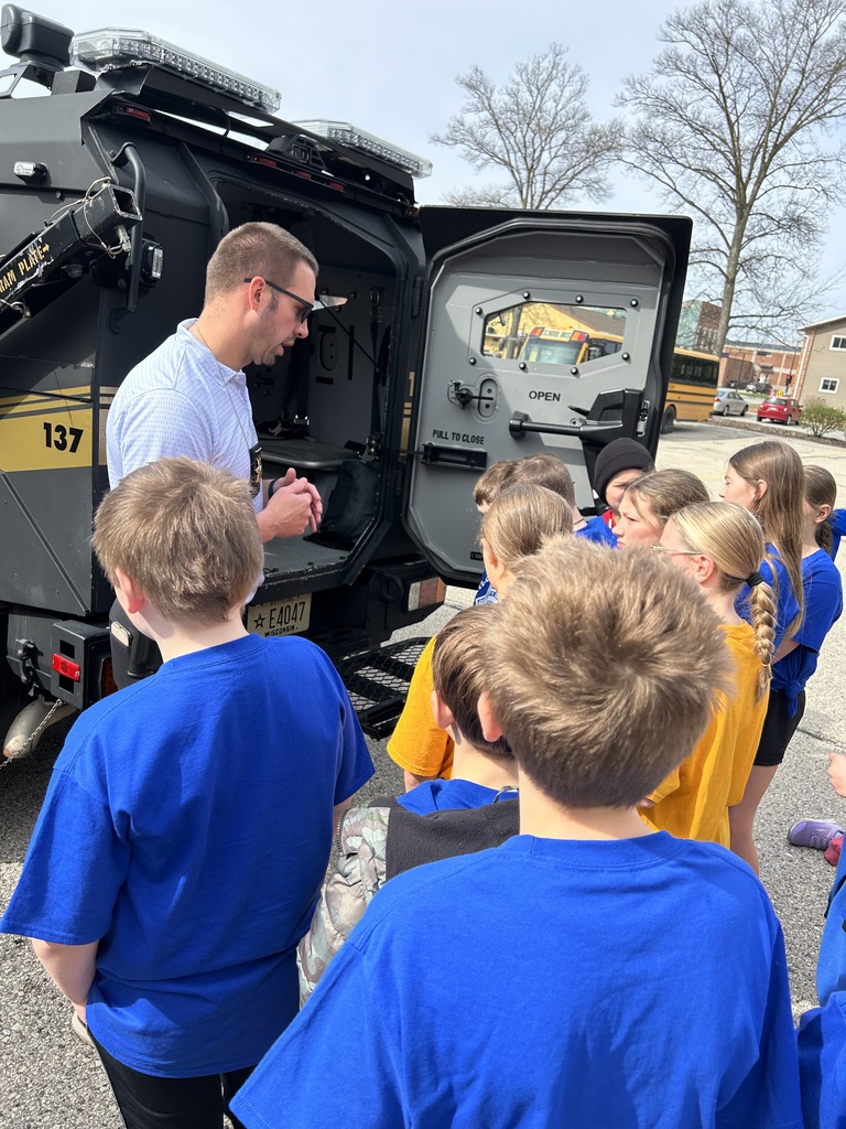 Students checking out the armored vehicle