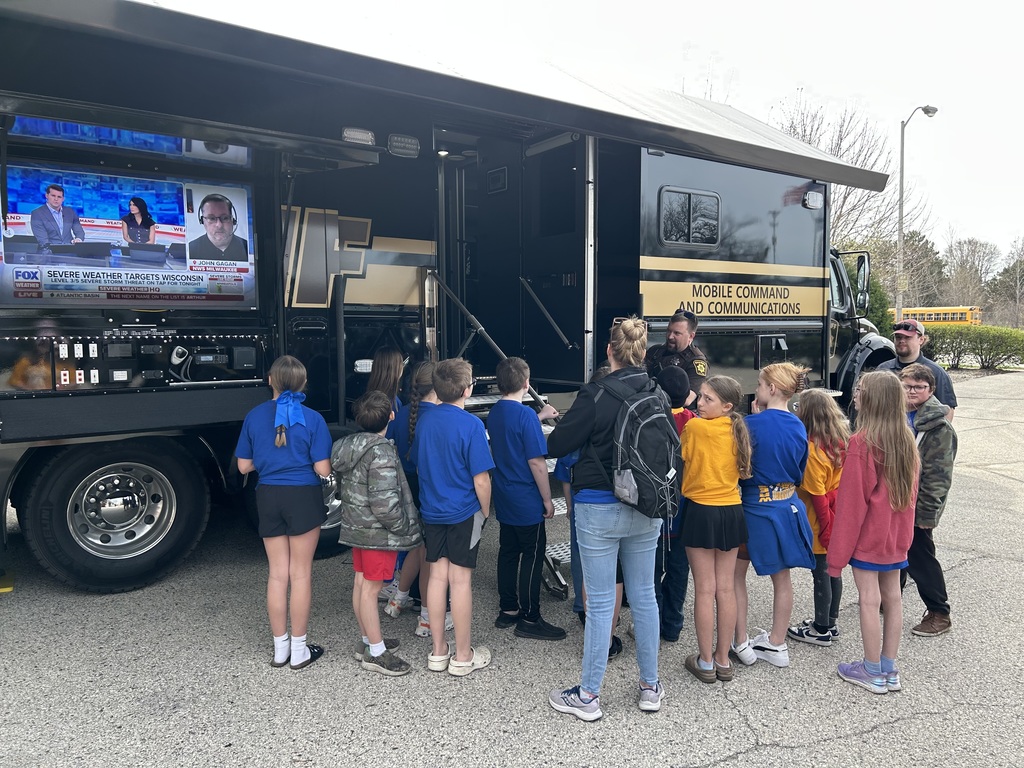 Students checking out the communications vehicle (mobile command center)
