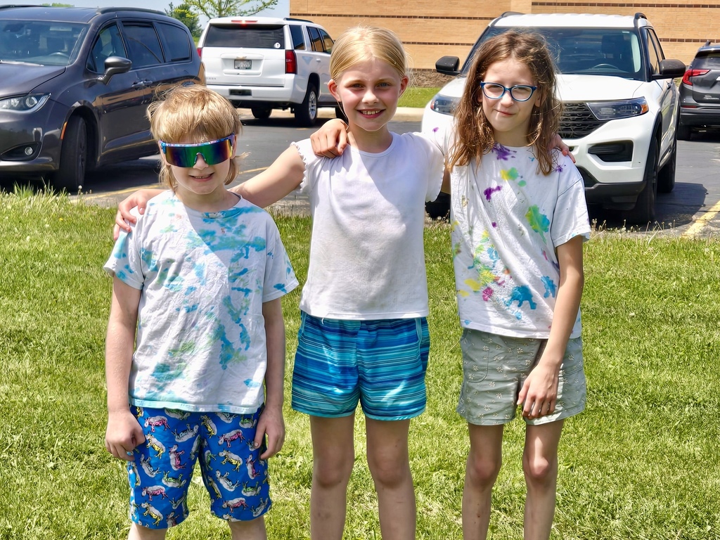 Three students smiling