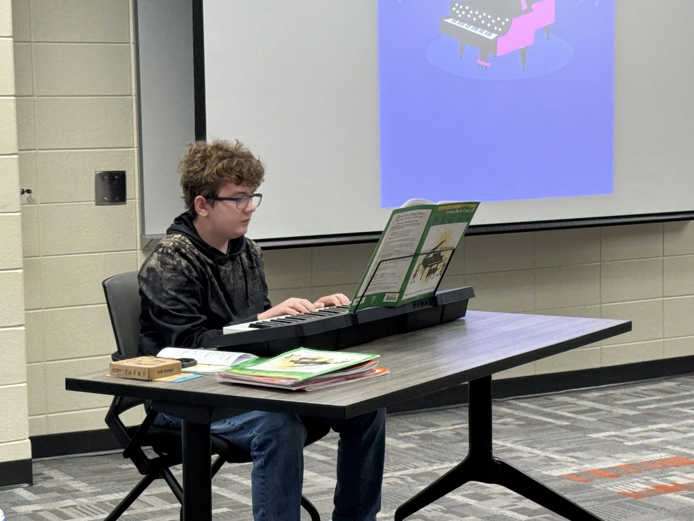 student playing the piano