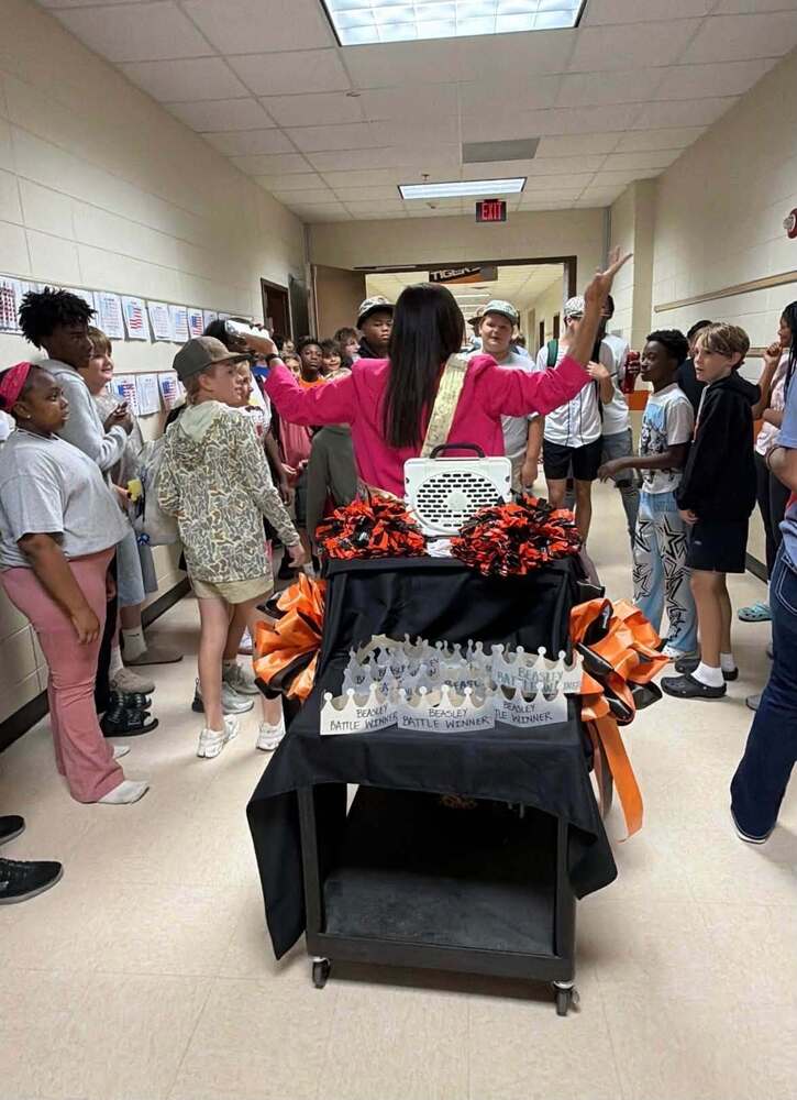 teacher talking with students