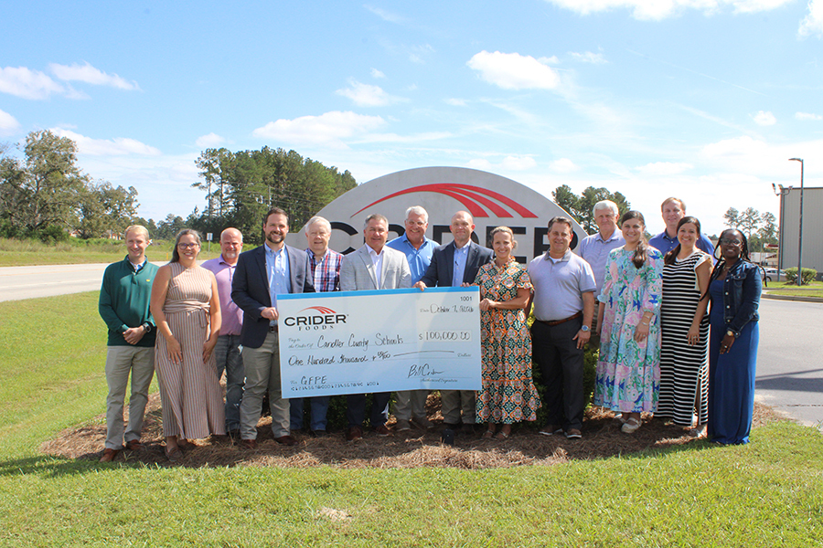 ccsd and crider staff holding $100K check