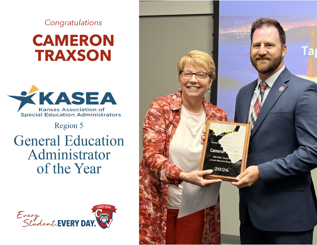 Photo of Mr. Traxson being presented a plaque recognizing him as General Education Administrator of the Year. 