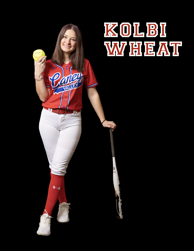 Kolbi Wheat leaning on her bat, holding a ball at shoulder height