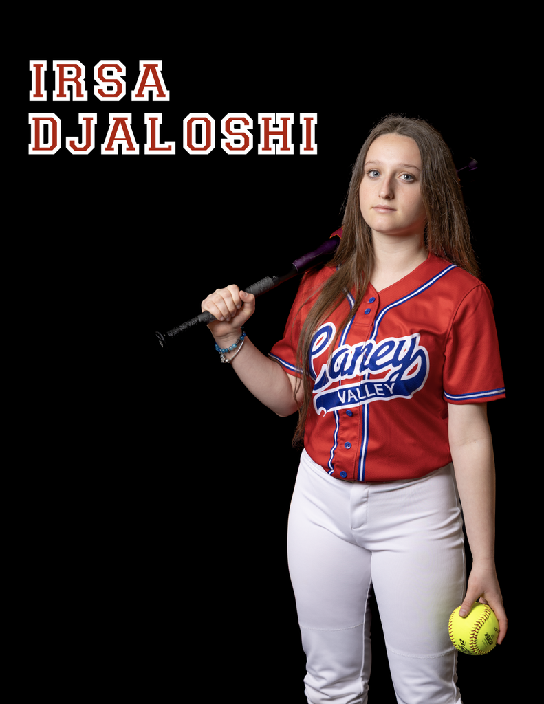 Irsa Djaloshi with a bat over her shoulder and ball resting in her other  hand 