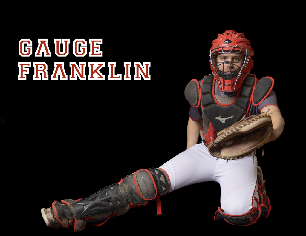 Gauge Franklin in a catcher pose with full catching gear on with leg outstretched