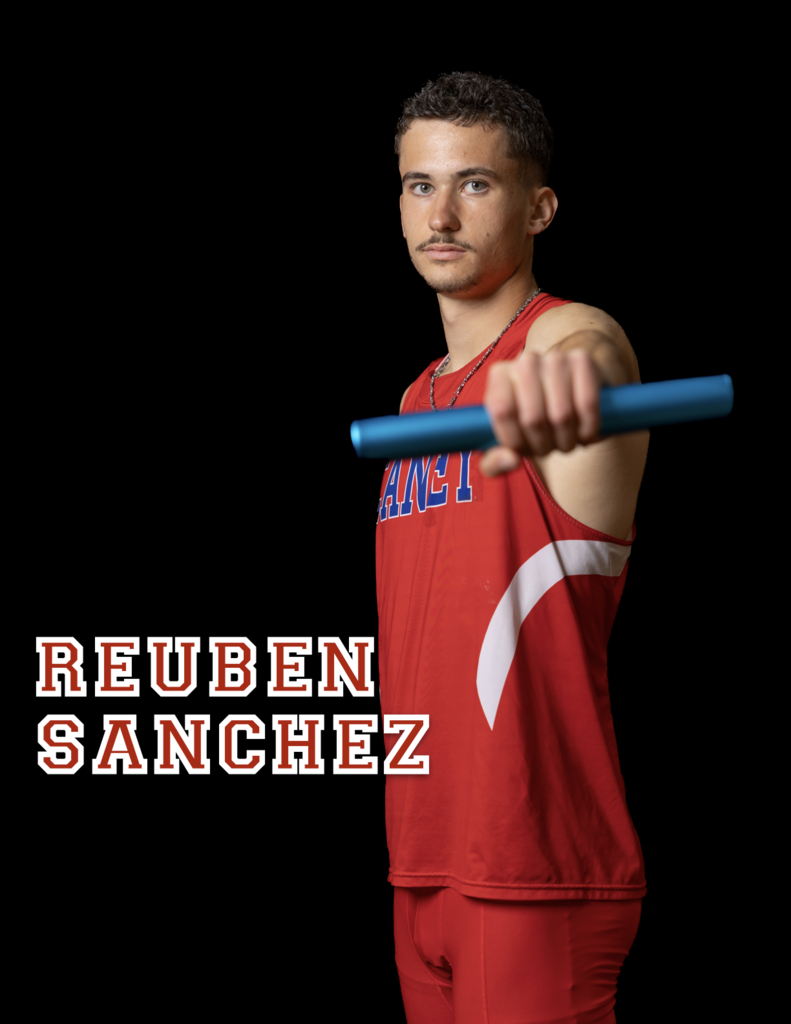 Reuben Sanchez with a baton held out in front of him 