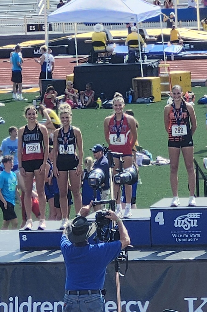 Senior Grace Prince stands on the 6th place block of the podium at Wichita State for the KSHSAA State Track event.