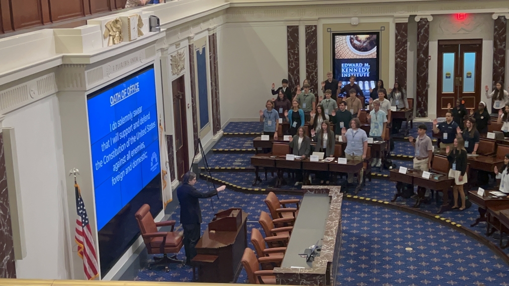 Student delegates from all 50 states take the Oath of Office inside the Edward M. Kennedy Institute's full-scale replica of the United States Senate Chamber. Designed to mirror the actual Senate floor in the U.S. Capitol, the chamber gave students the opportunity to experience the legislative process in an authentic setting as they were sworn in before debating and drafting recommendations for the future of AI in education.