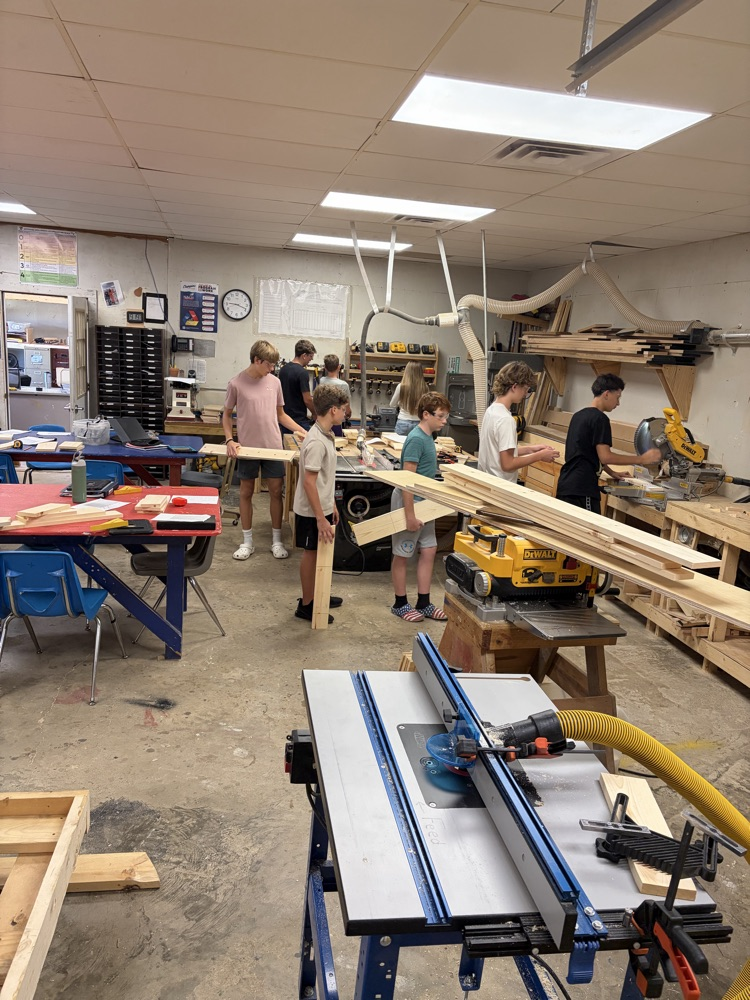 students measuring boards