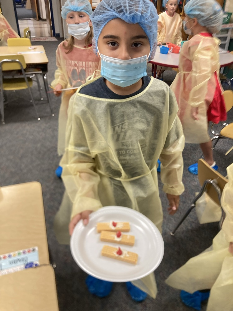 student showing band aid food