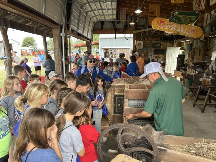 students learning about corn mill
