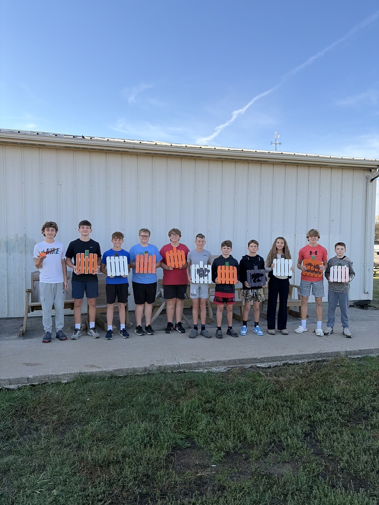Industrial Tech students making pumpkins