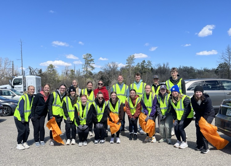 students cleaning on earth day