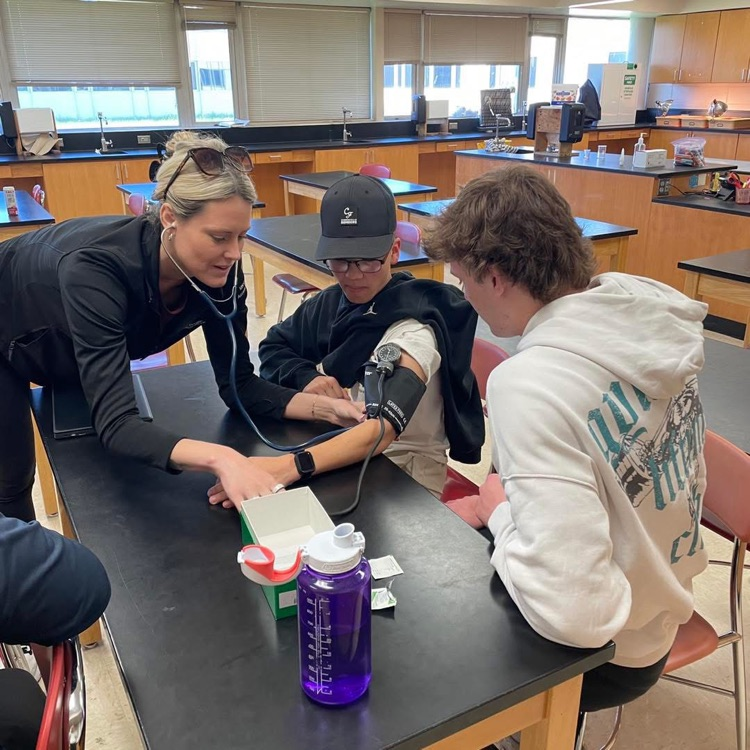 students learning to check blood pressure