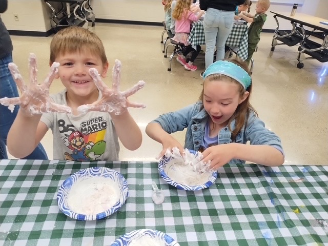 students playing with cloud dough