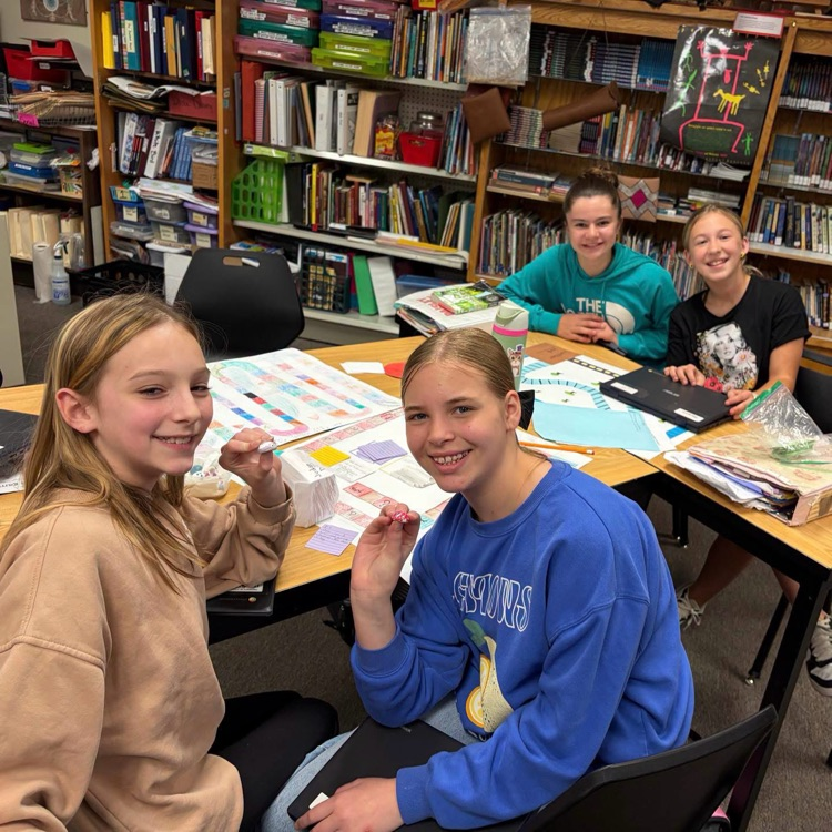 students pictured with board games