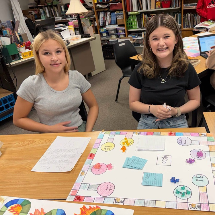 students pictured with board games