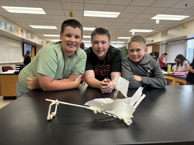 students with sail car