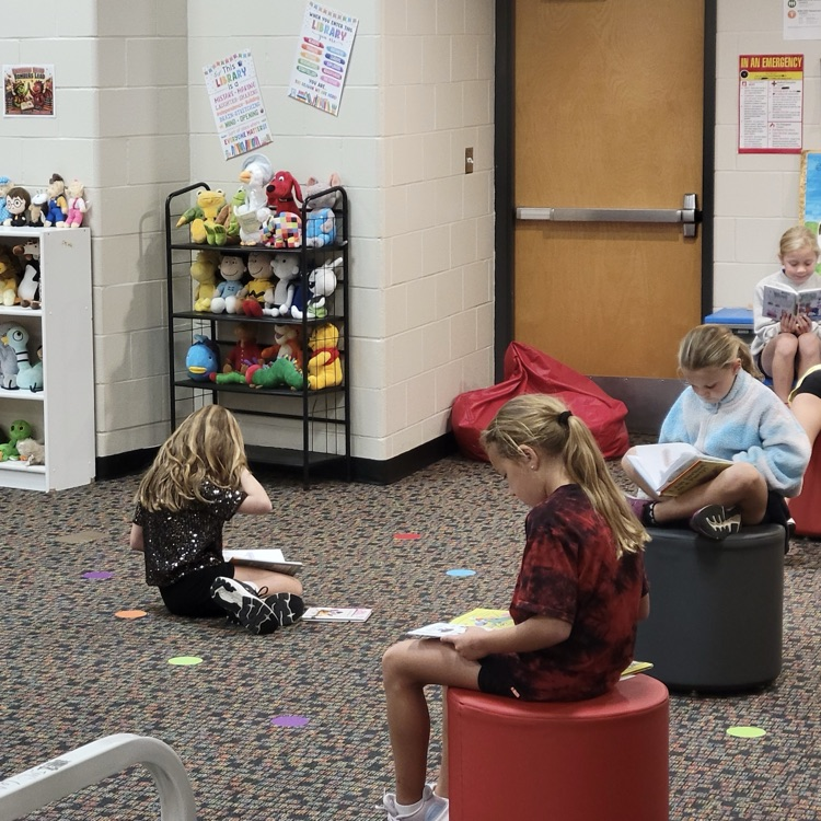 students reading in the library
