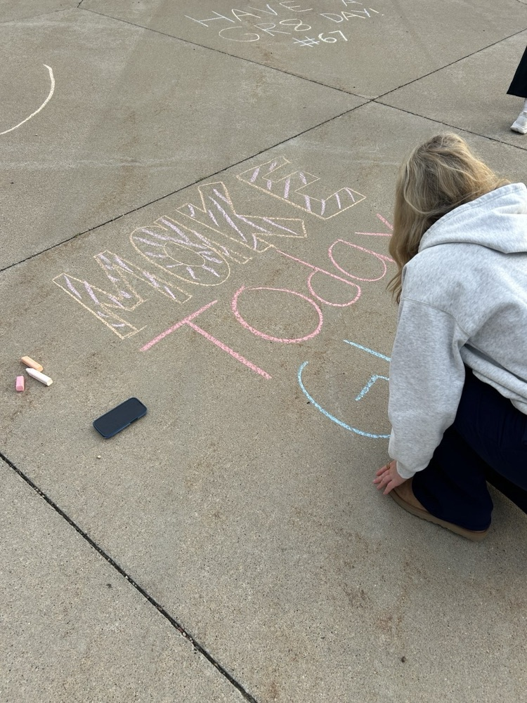 students chalking the walk before school 