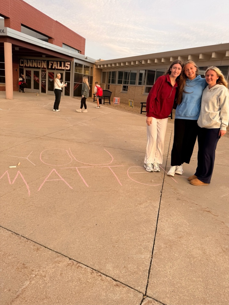 students chalking the walk before school 