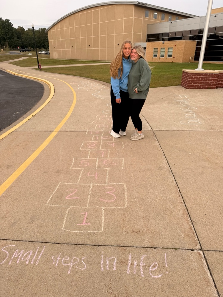 students chalking the walk before school 