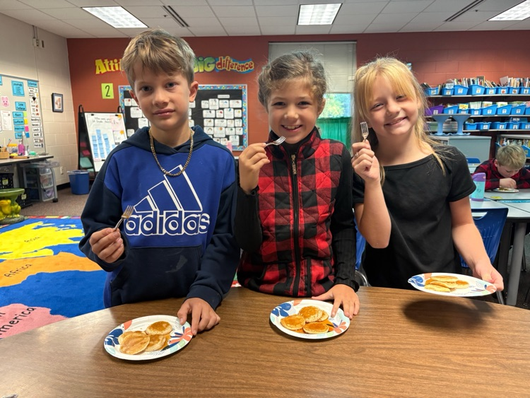 students eating pancakes