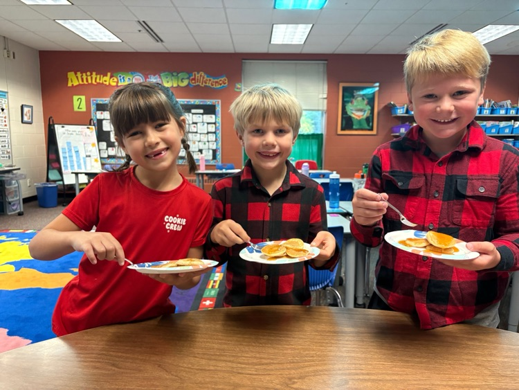 students eating pancakes